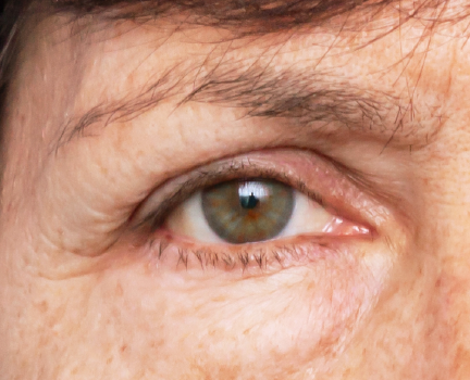Close-up of eye area highlighting natural signs of aging